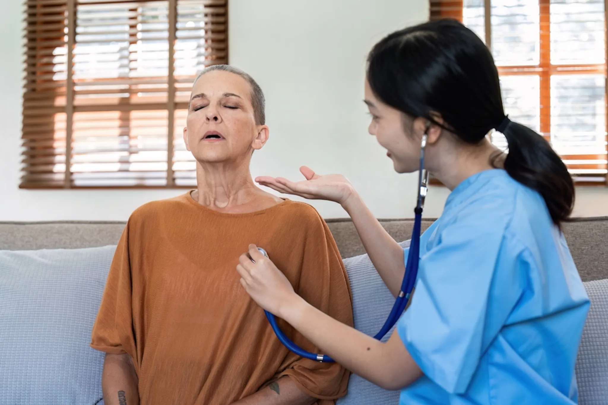 Lady checking her heart rate with a doctor