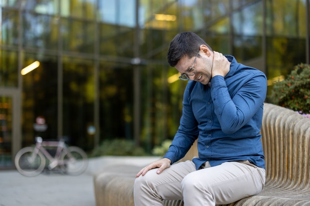 man experiencing muscle fatigue low iron