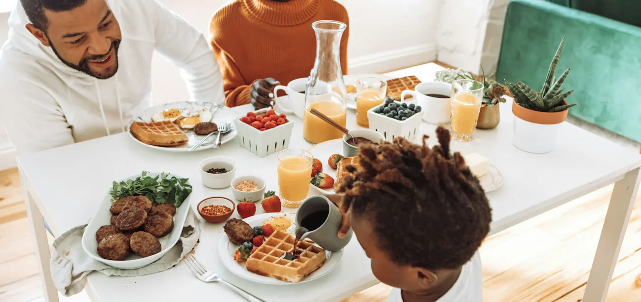 A family enjoying a meal following MyPlate guideline