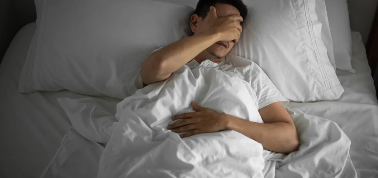 Person struggling to fall asleep