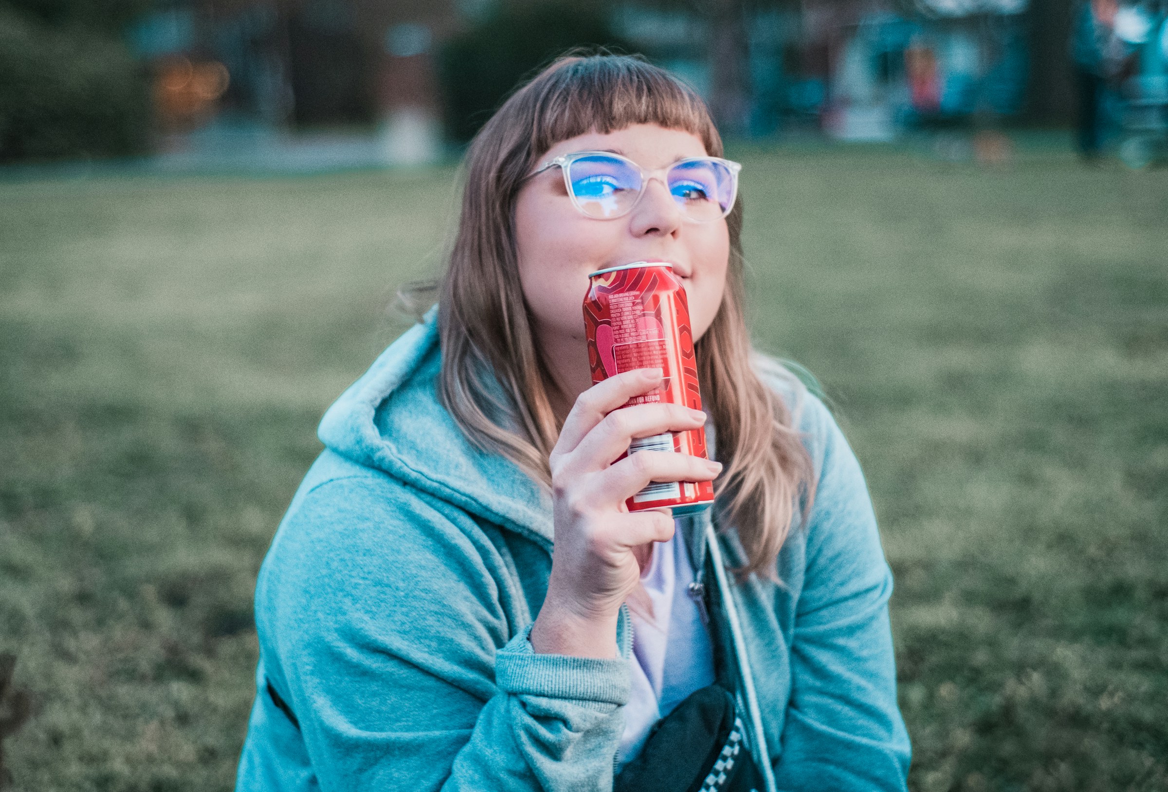A lady taking soda with HFCS