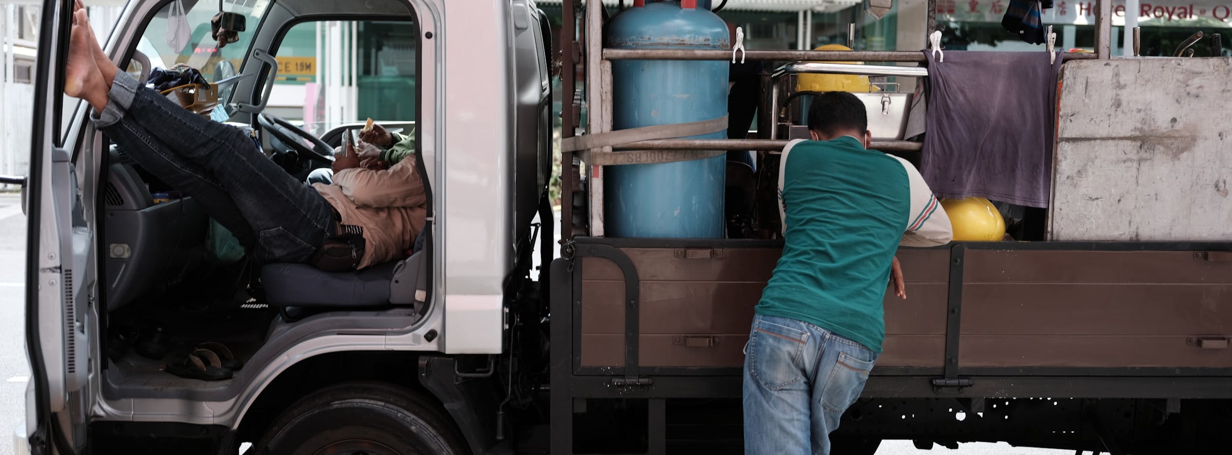 A truck driver taking a break to observe siesta