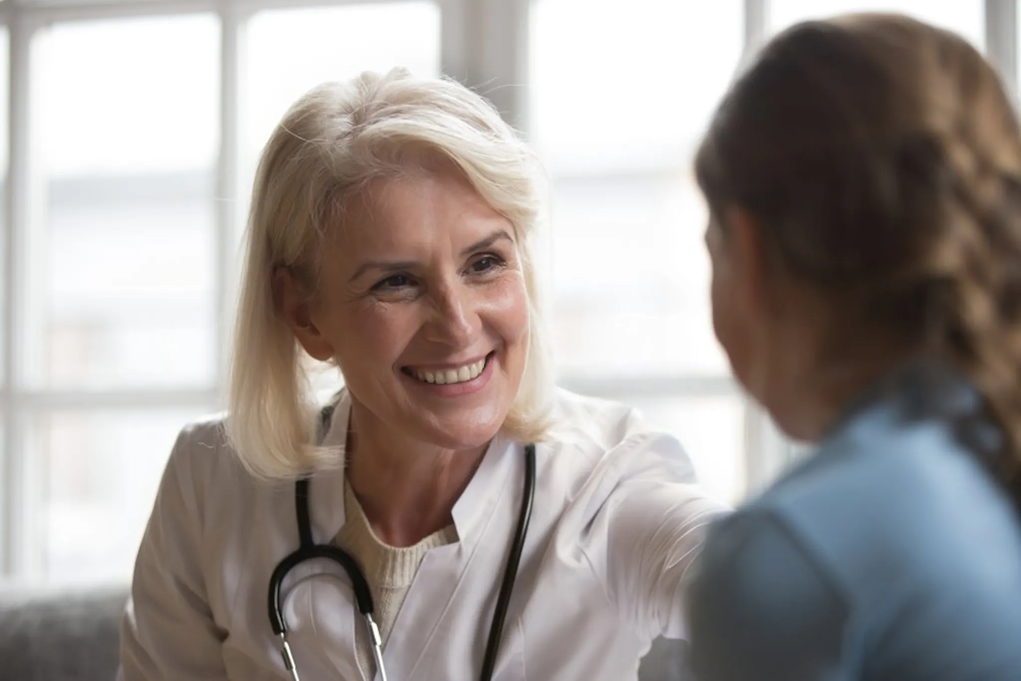 Patient speaking to a healthcare practitioner
