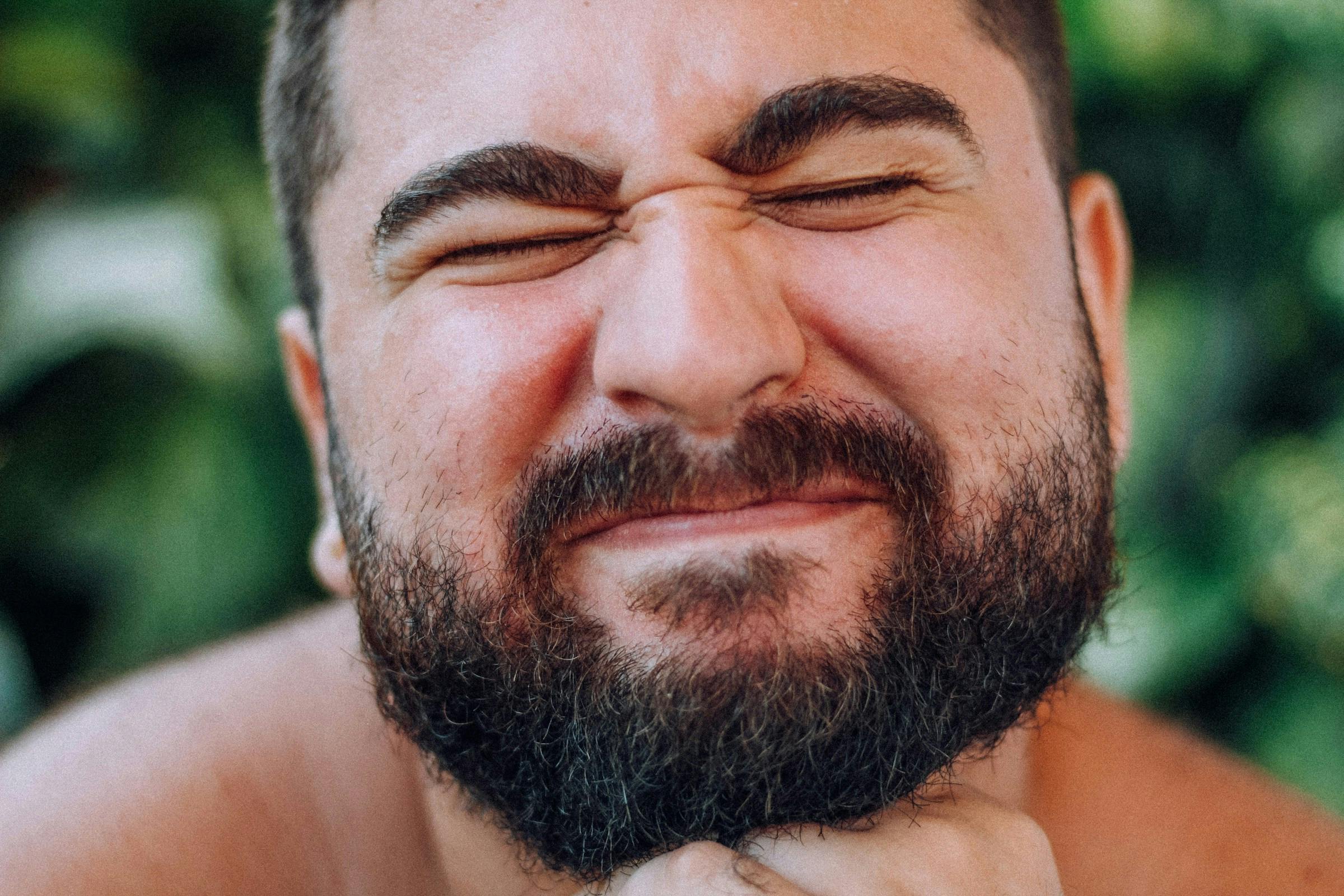 A man doing facial exercise