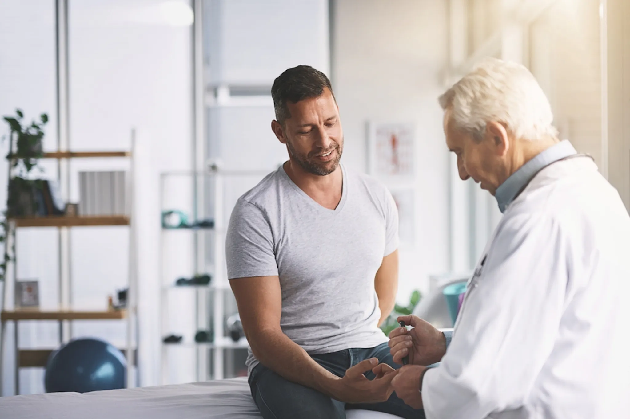 Man getting his lipid panel test done at the hospital