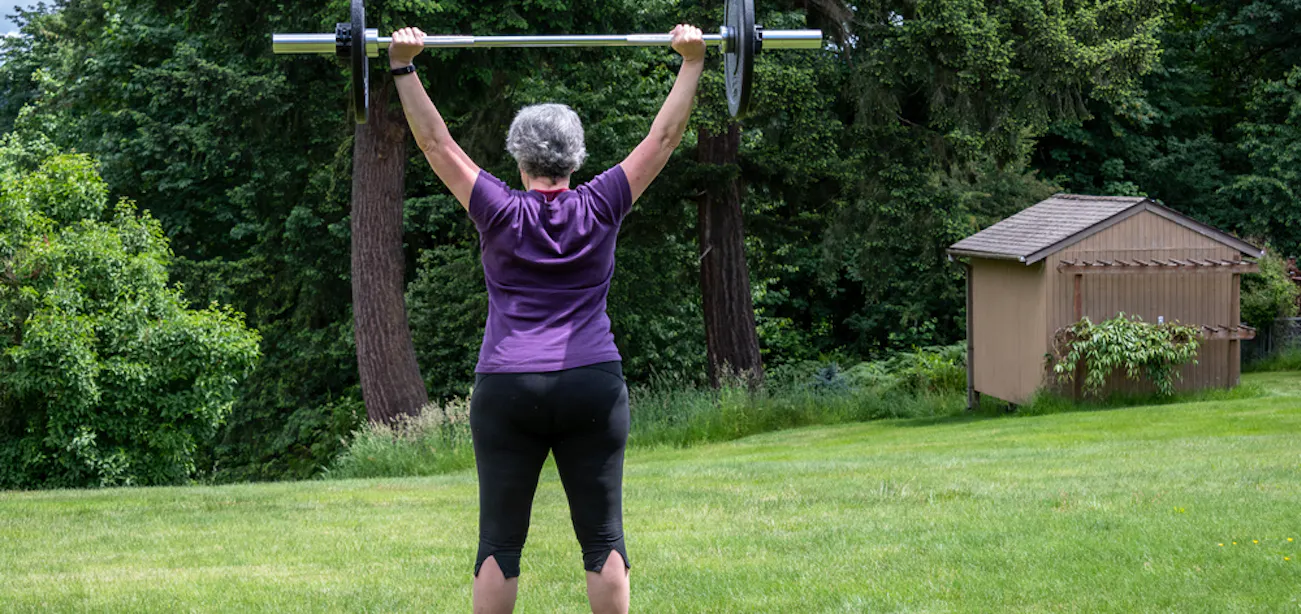 A middle-aged lady doing strength training