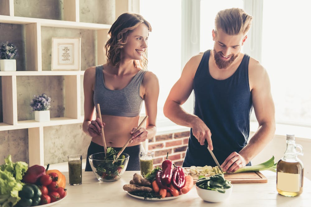 A couple preparing protein-rich meal