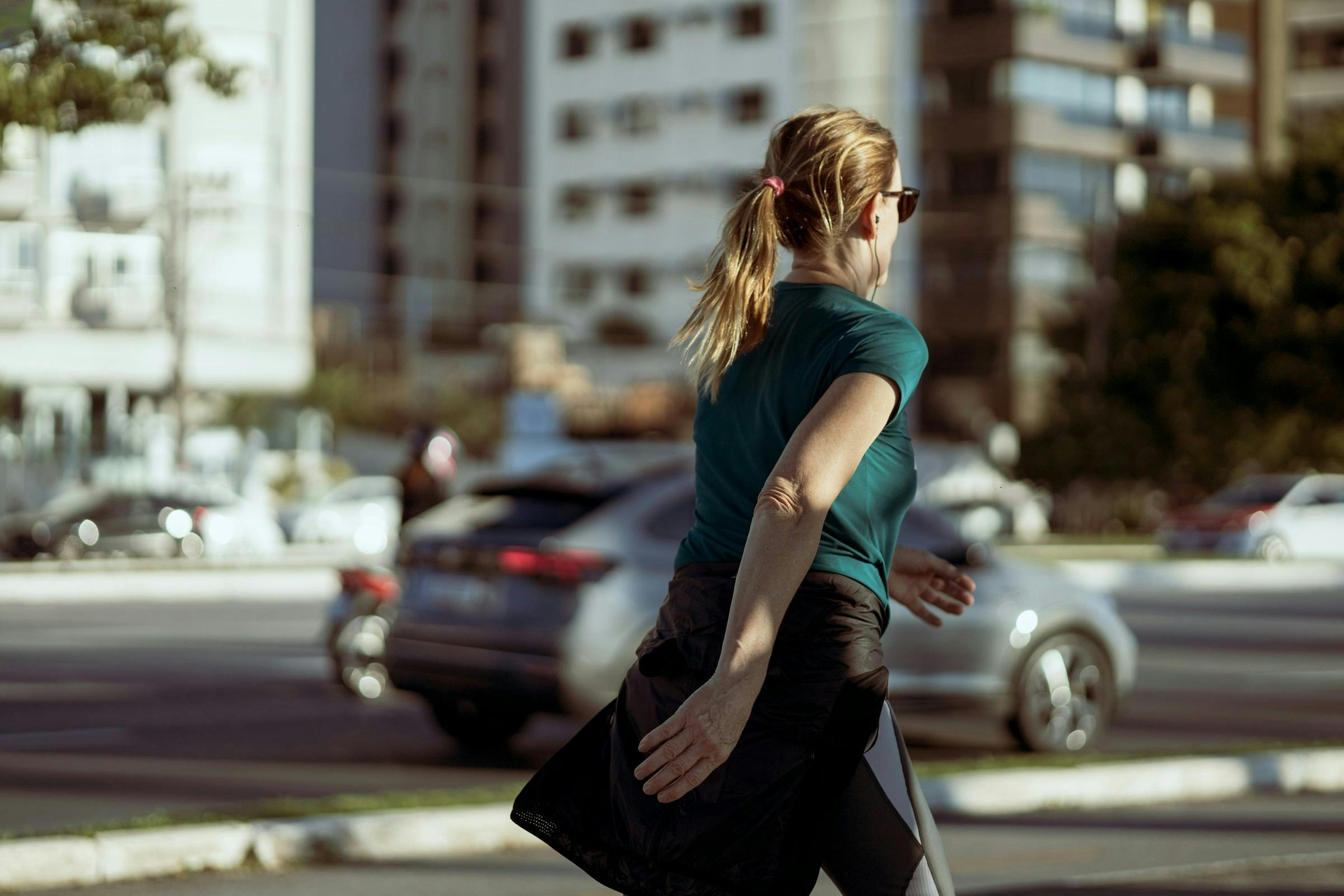 A middle aged lady taking a brisk walk