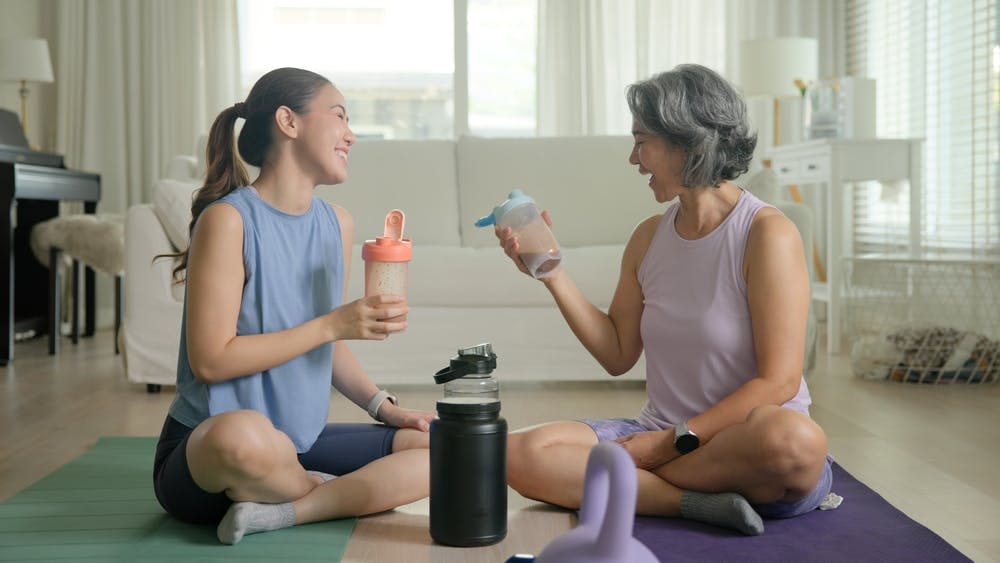 An older and younger lady exercising
