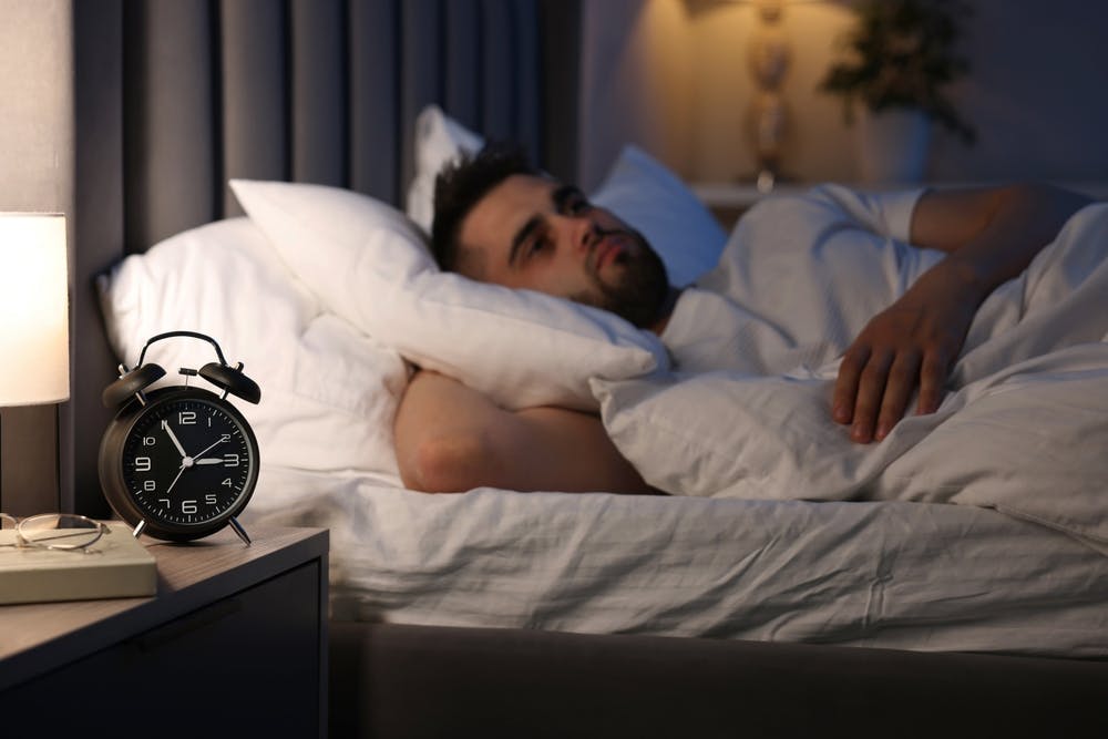Person thinking how to Reduce Hypnic Jerks Naturally
