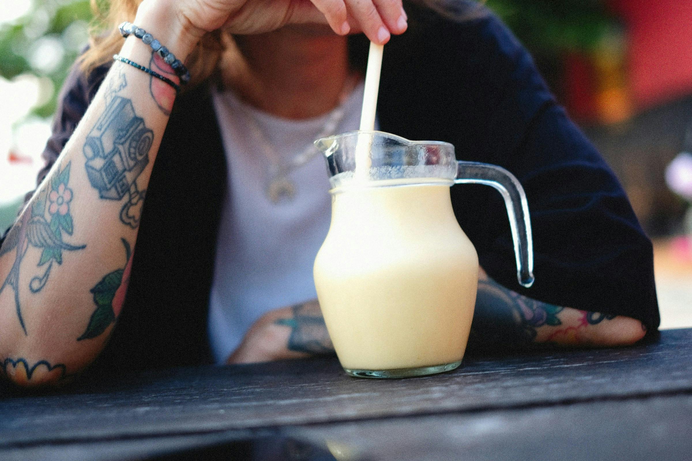 Person drinking coconut milk