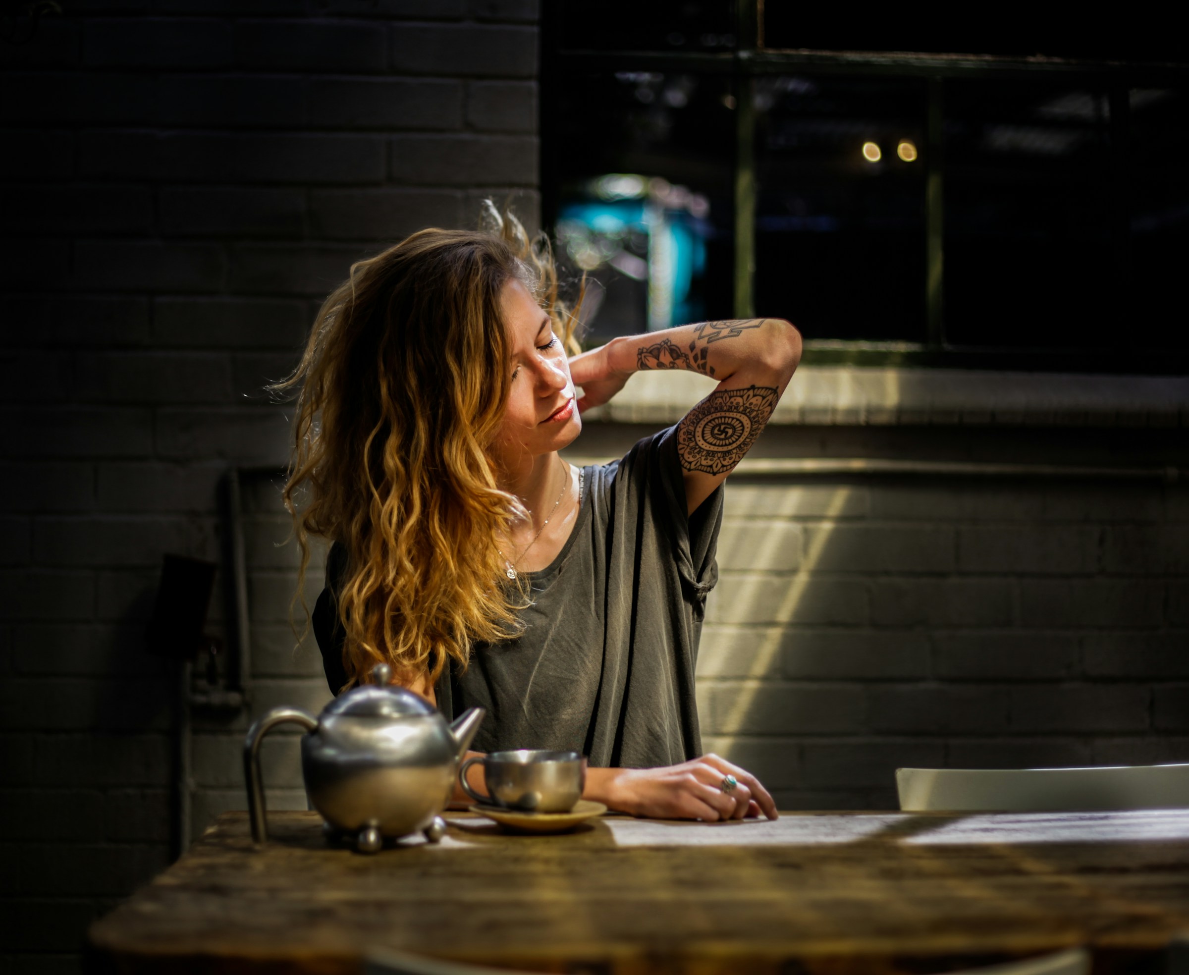 A lady taking adaptogens to reduce her  stress due to high cortisol levels