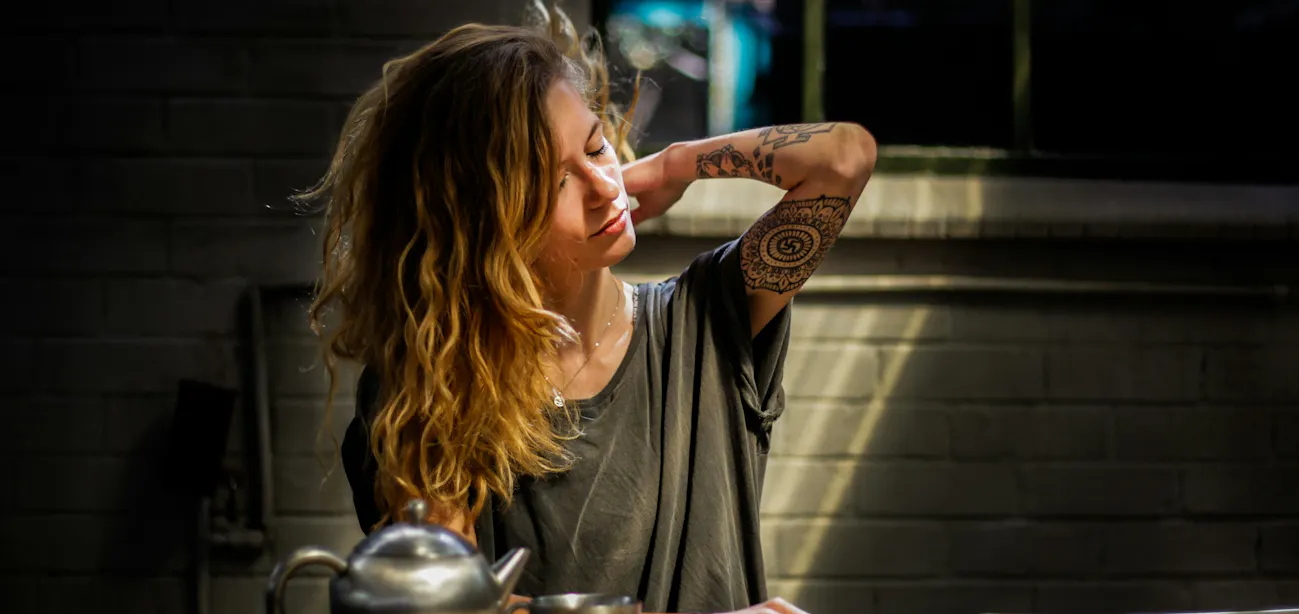 A lady taking adaptogens to reduce her stress due to high cortisol levels