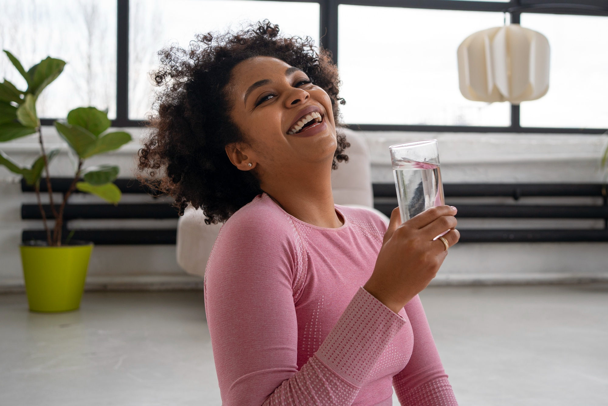 A lady taking vitamin D3 to increase calcium absorption and vitamin K2 directs calcium to bones instead of arteries