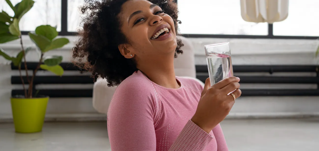 A lady taking vitamin D3 to increase calcium absorption and vitamin K2 directs calcium to bones instead of arteries