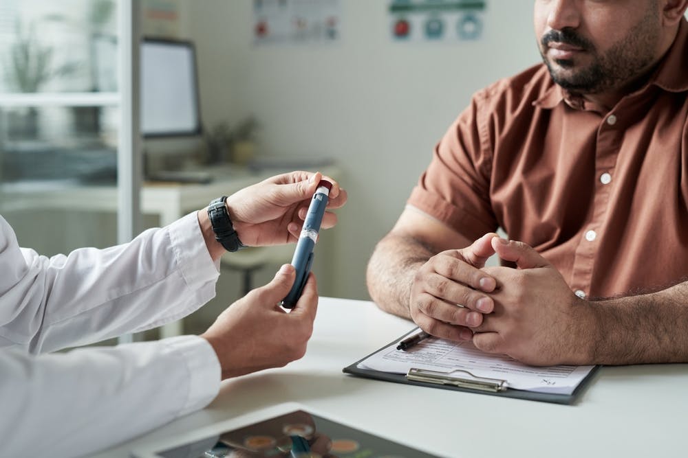 Patient with a doctor for GLP-1 drug