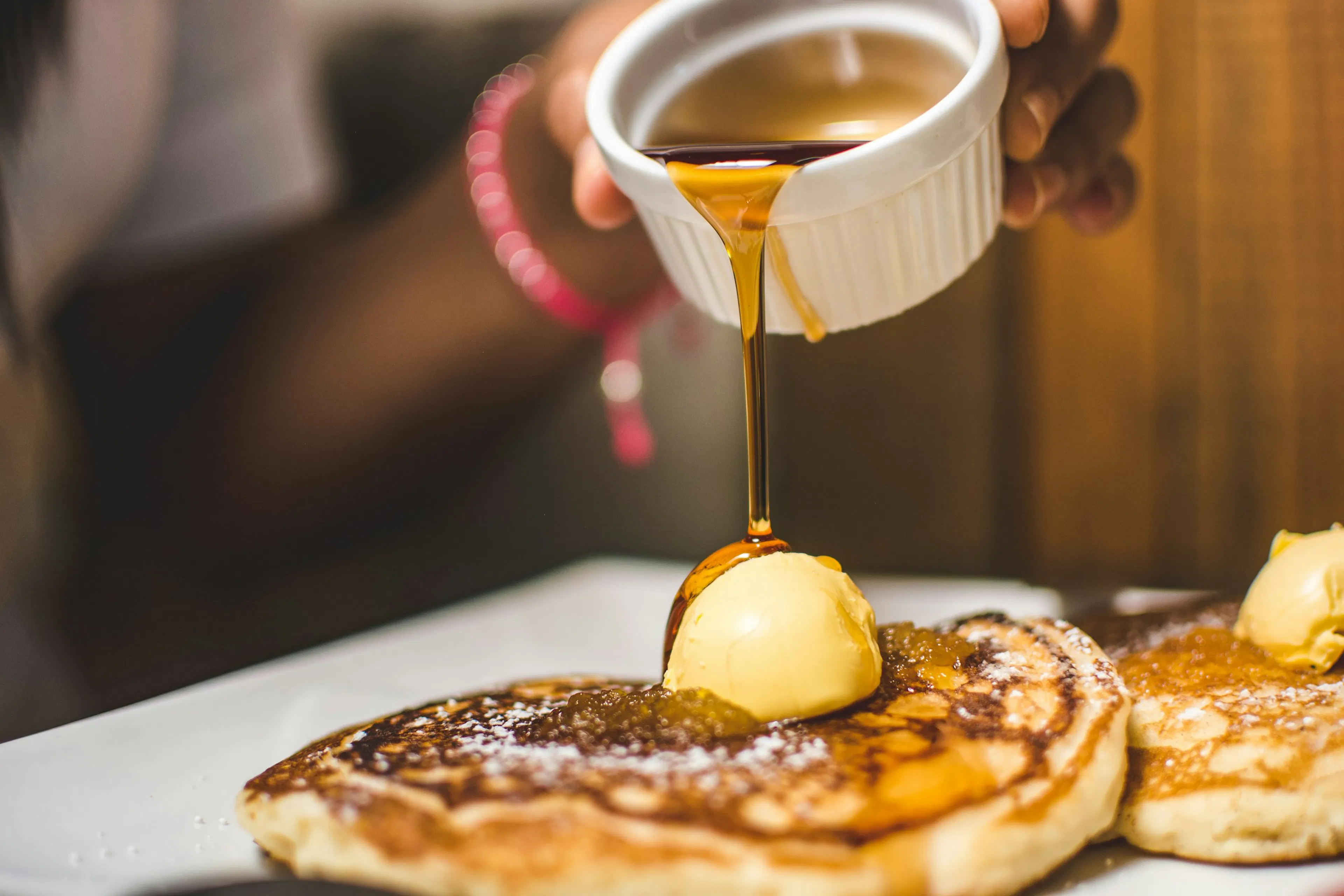 A person replacing sugar and honey