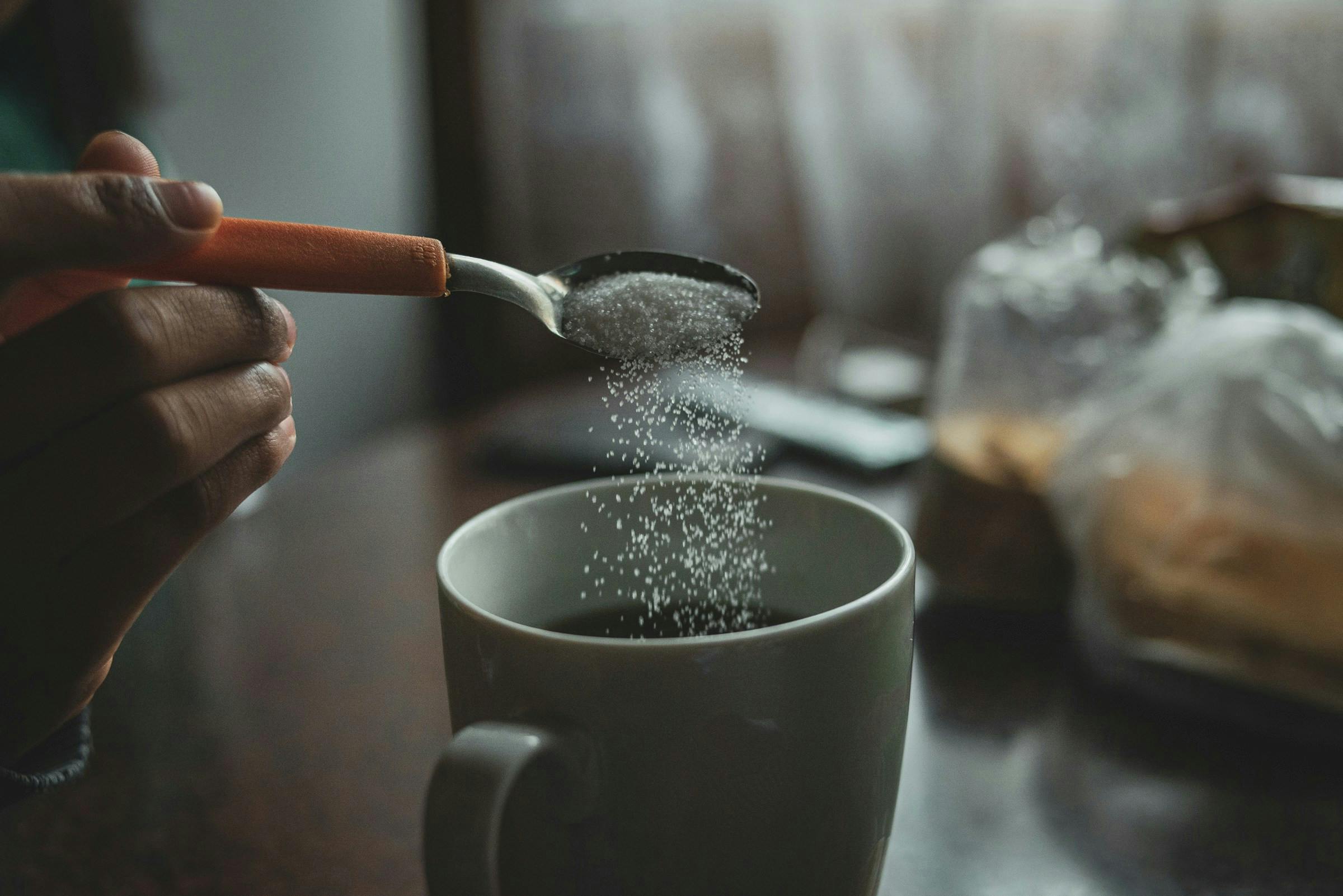Person using granulated sugar
