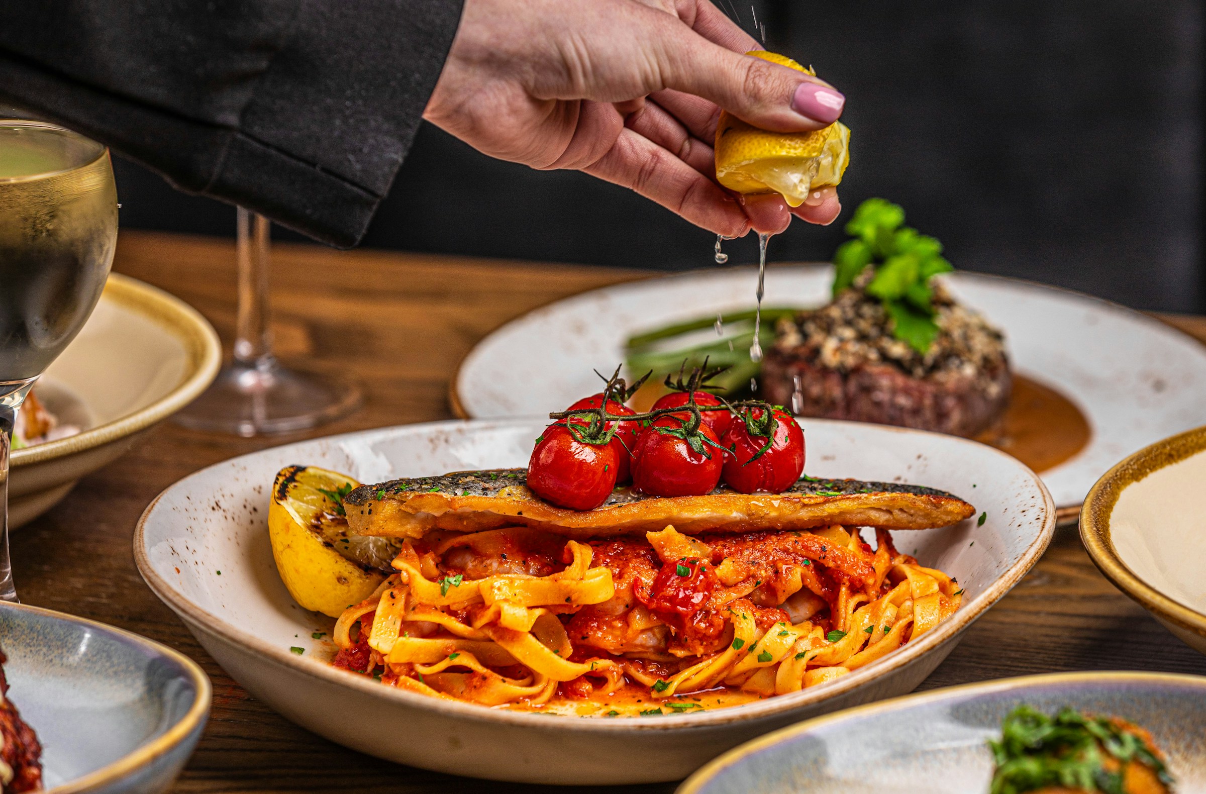 Mediterranean diet plate with olive oil, vegetables, and fish for metabolic syndrome