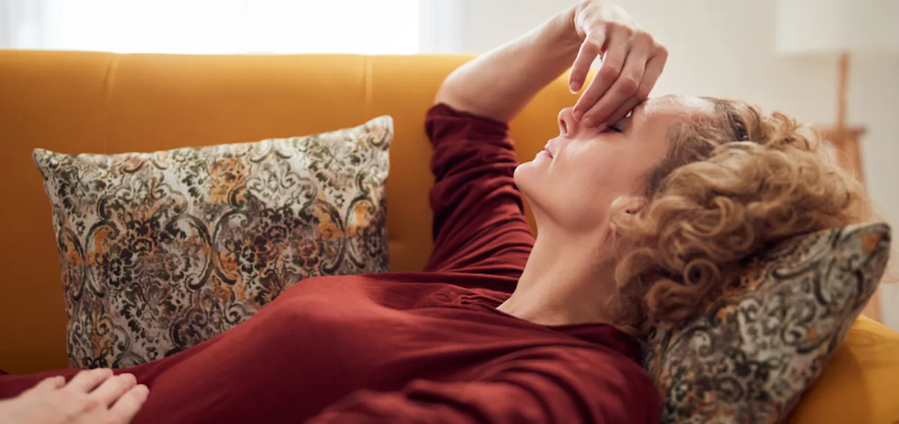 A lady experiencing cramps during menopause
