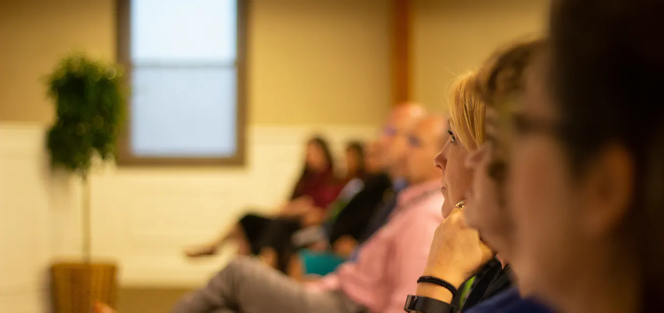 A clinician reviewing peptide drug data with a group of clinicians in 2026