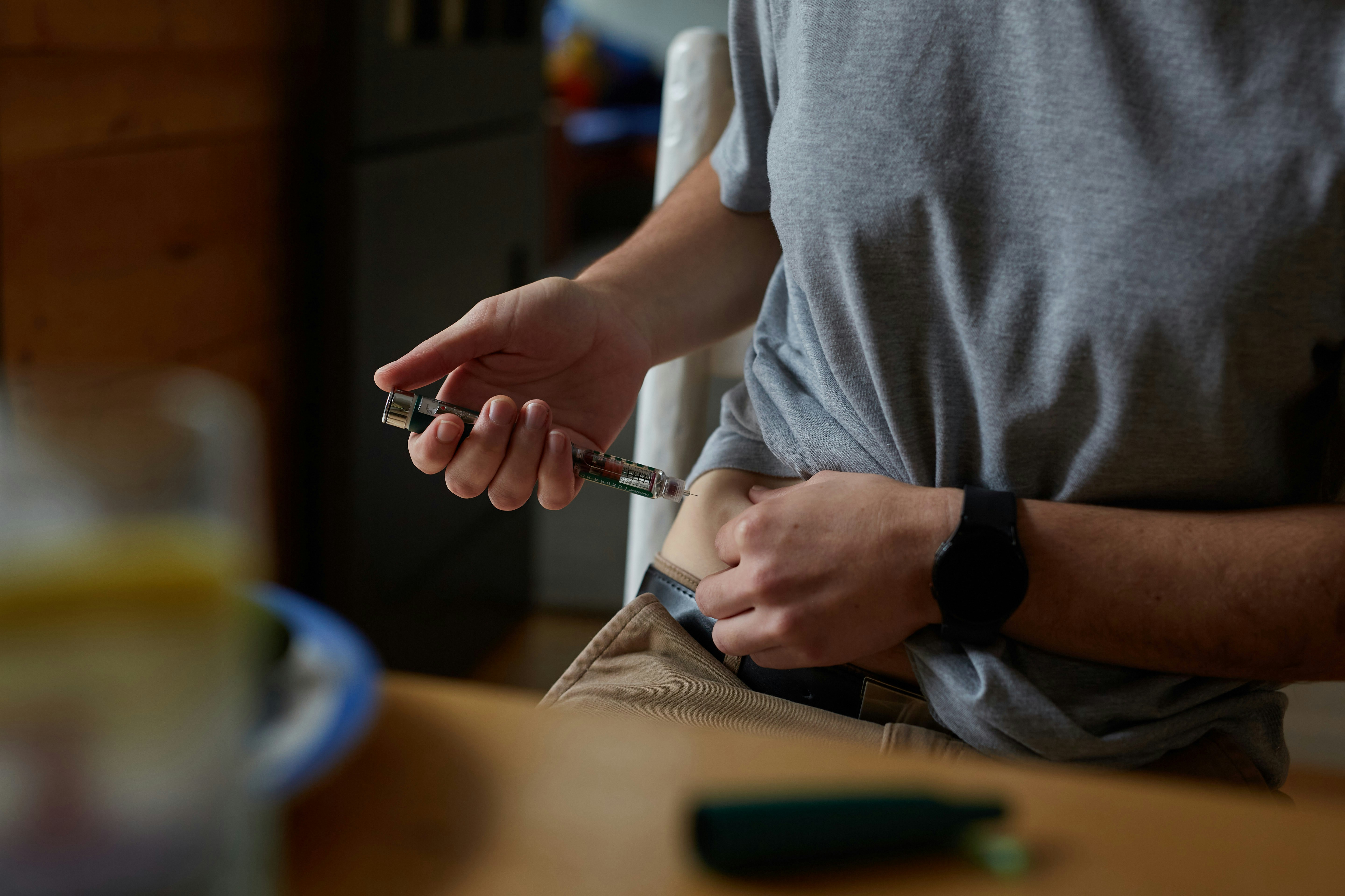 Person self-injecting a peptide medication