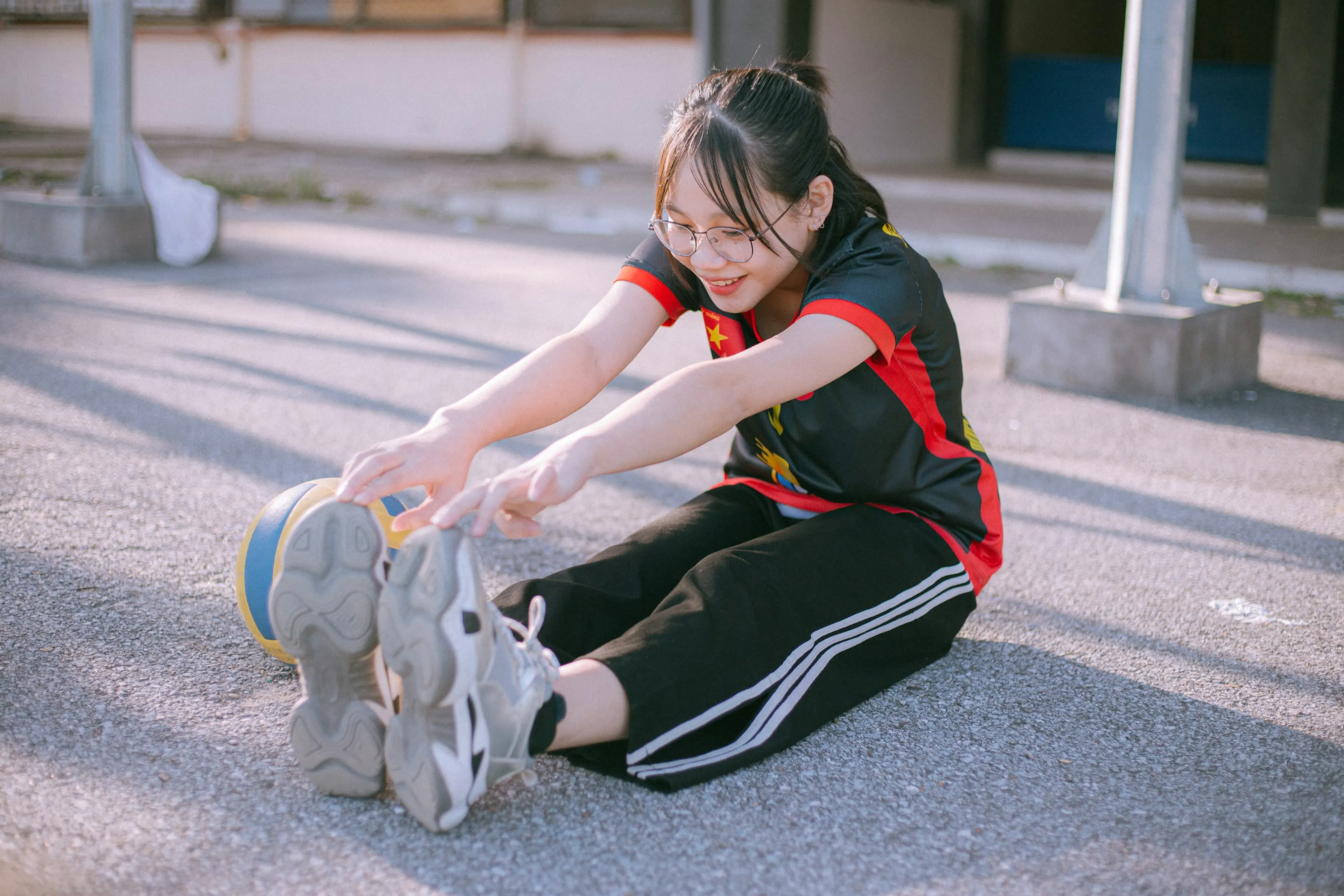 Image showing a lady stretching before exercising to prevent injury and ensure proper recovery