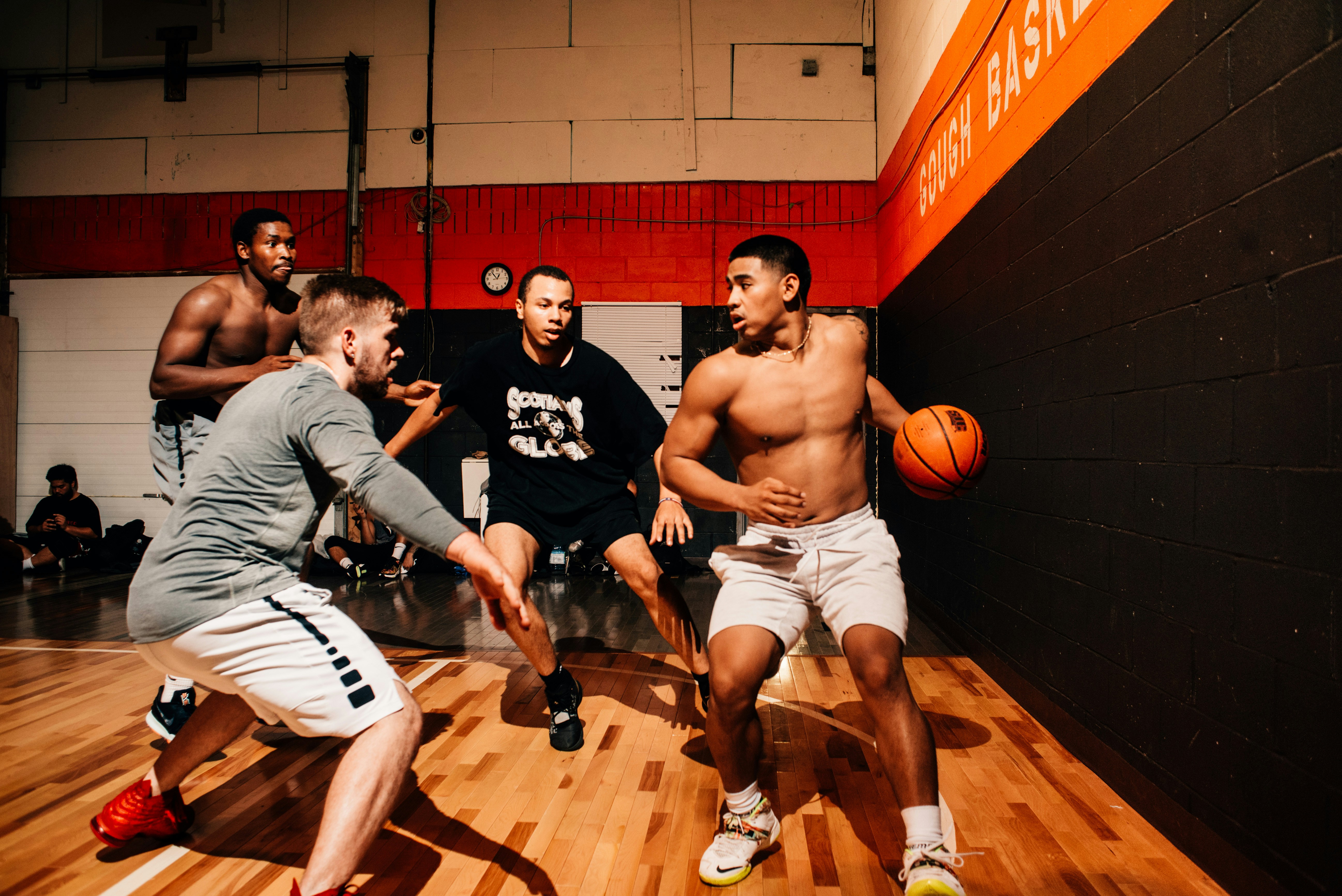 A group of men with high testosterone playing basketball