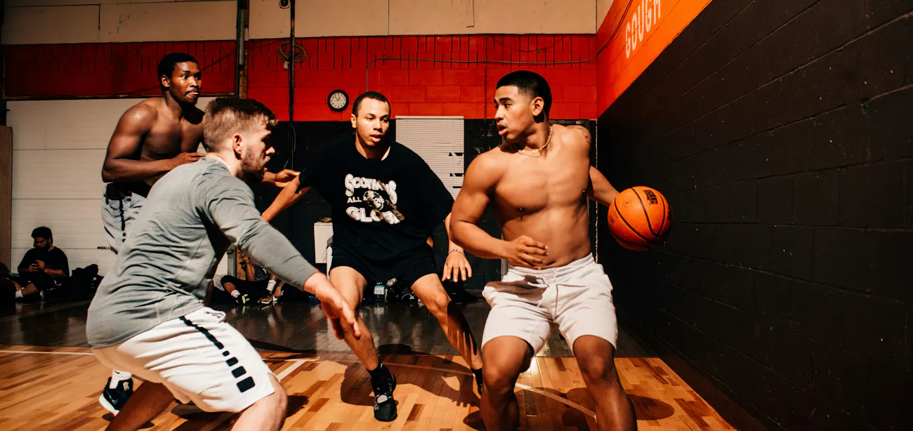 A group of men with high testosterone playing basketball