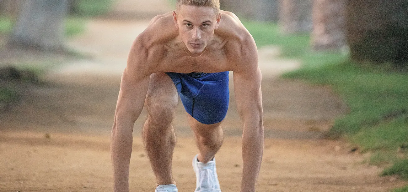 An image showing a well built young man exercising