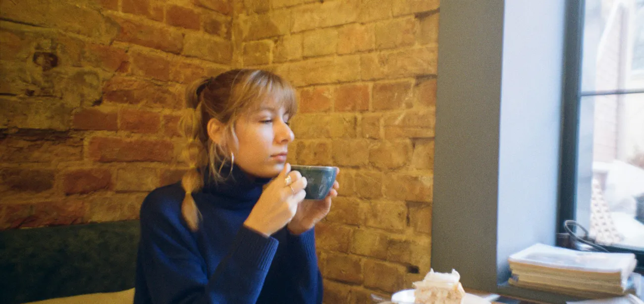 An image showing a lady with insulin resistance in a cade sipping tea
