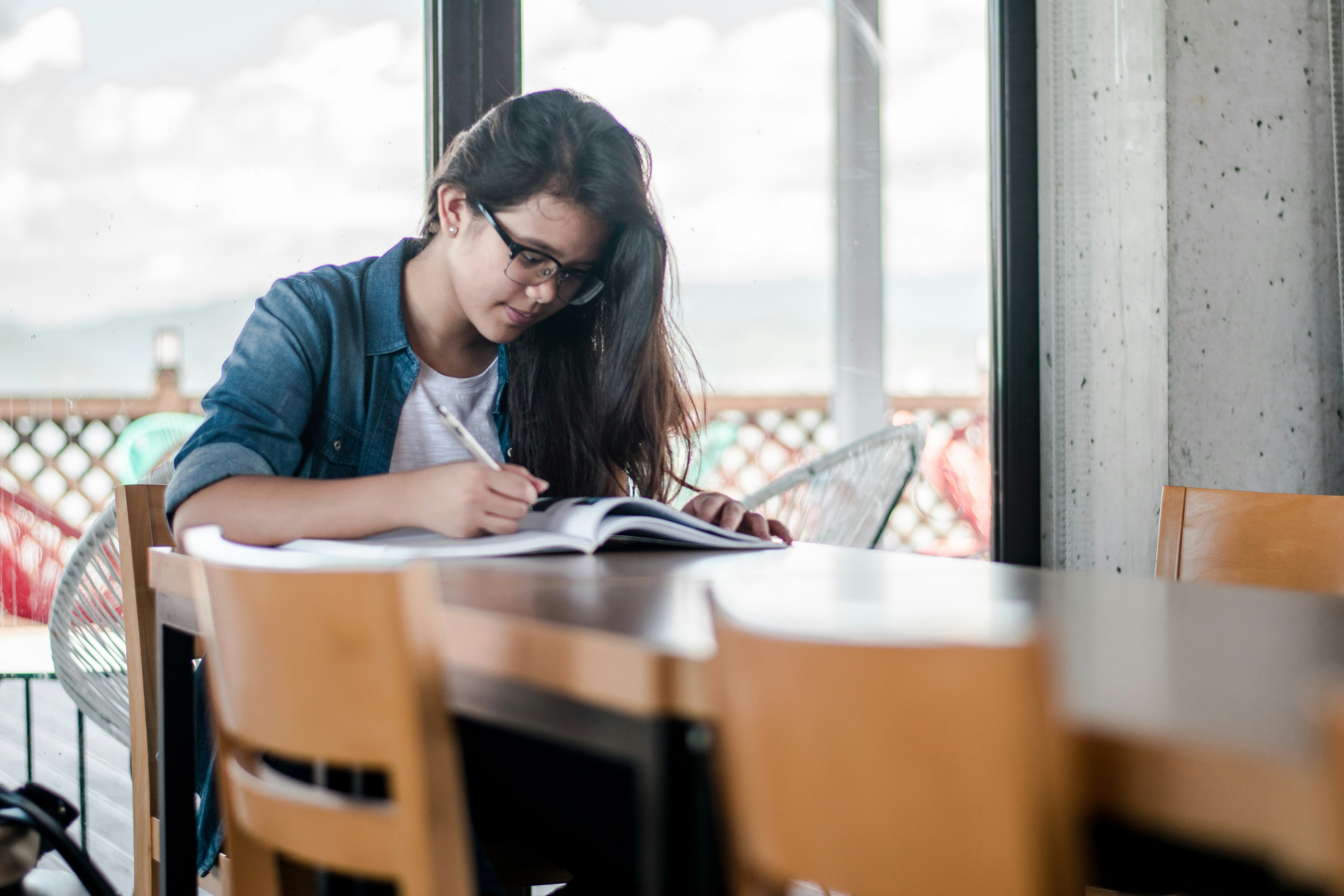 An image showing a lady reading, who uses Semax and Selank peptides to improve cognition