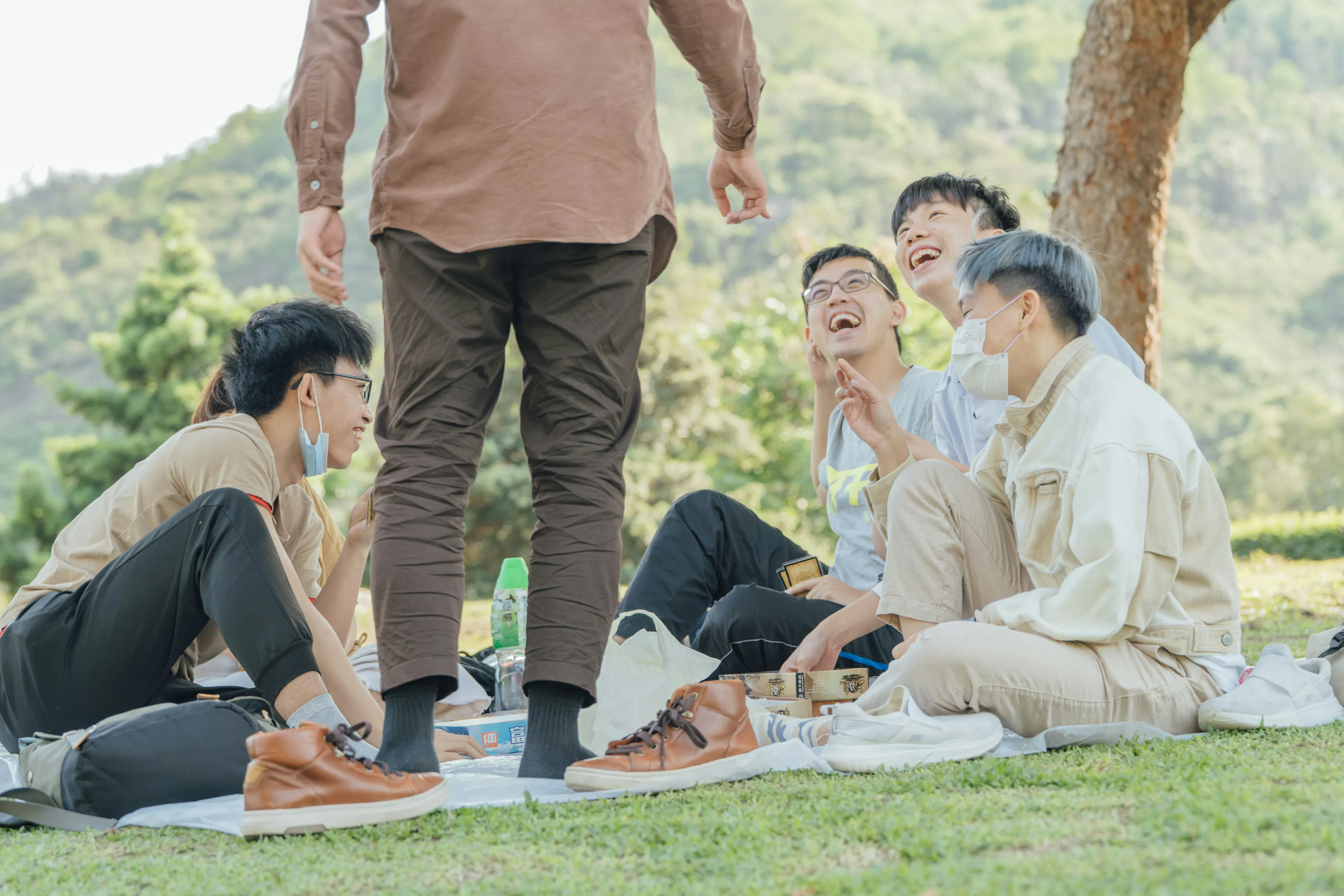 An image showing a group of young men discussing about peptide therapy for men