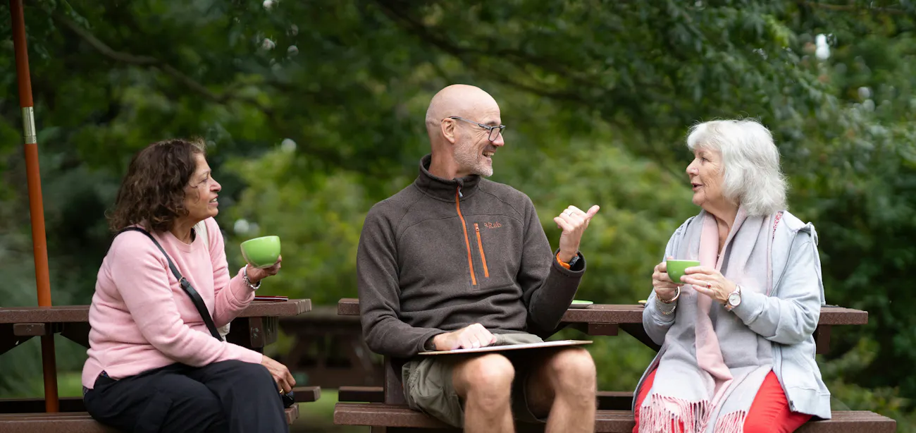An image showing a group of older adults discussing the best peptide therapy for people of their age
