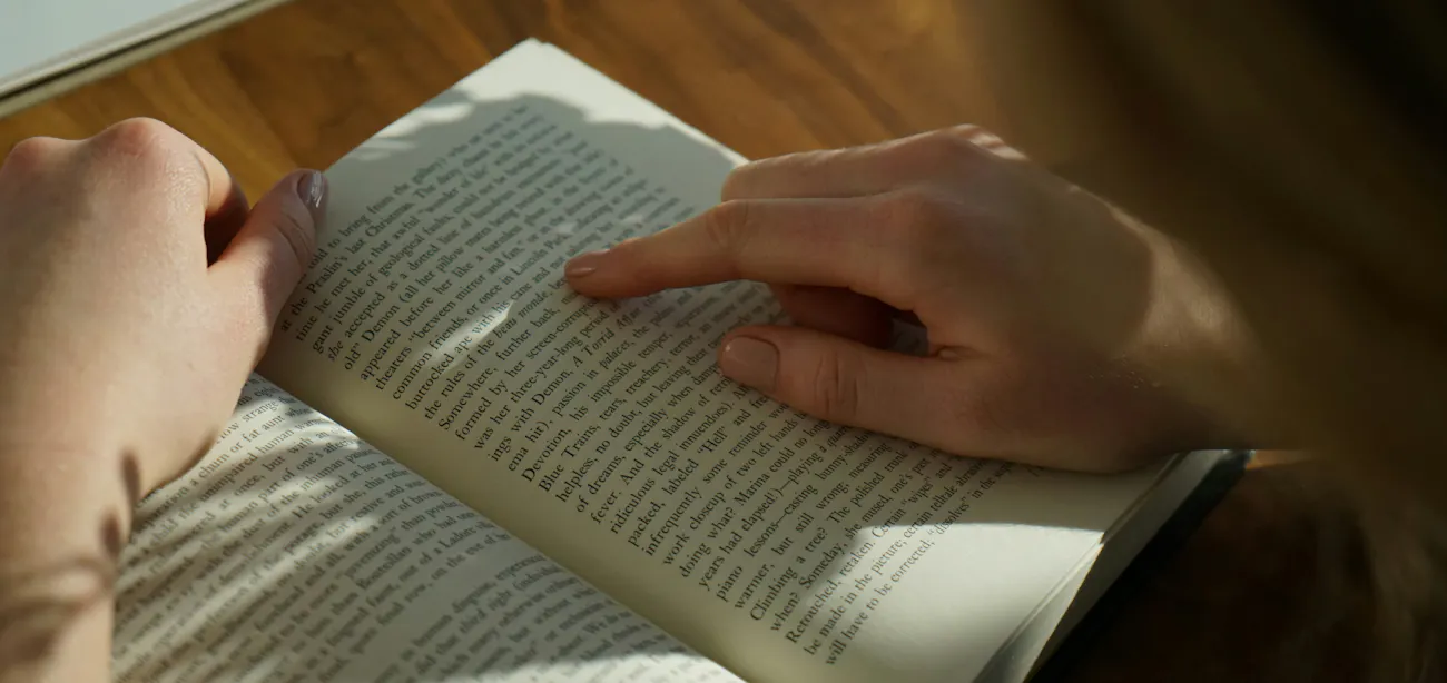 An image showing a person reading a peptide therapy glossary to understand more about peptides