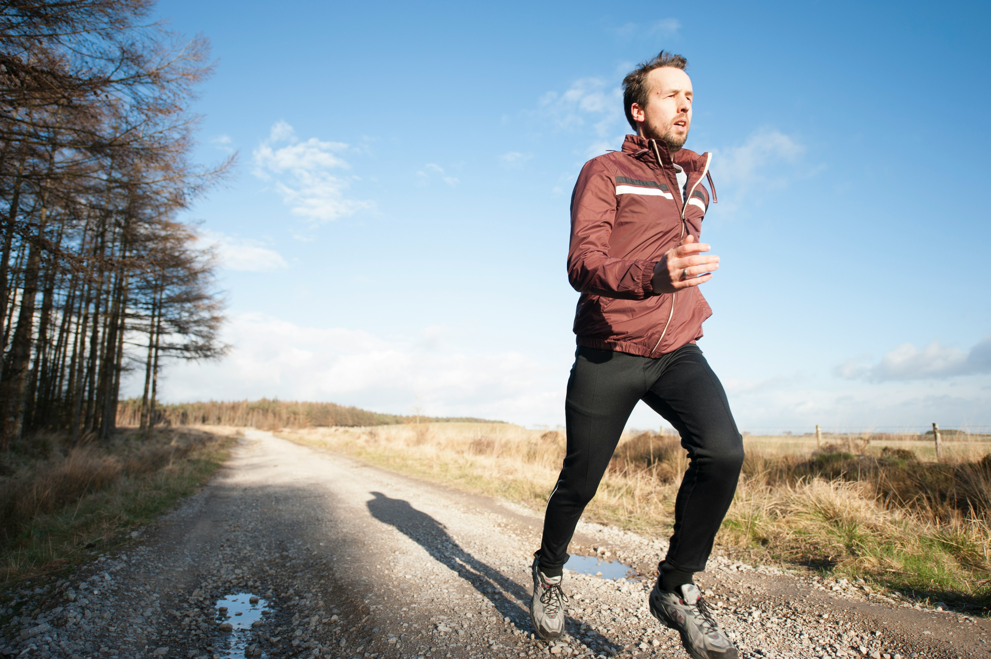 An image showing a young man jogging for a healthy cardiac metabolic health
