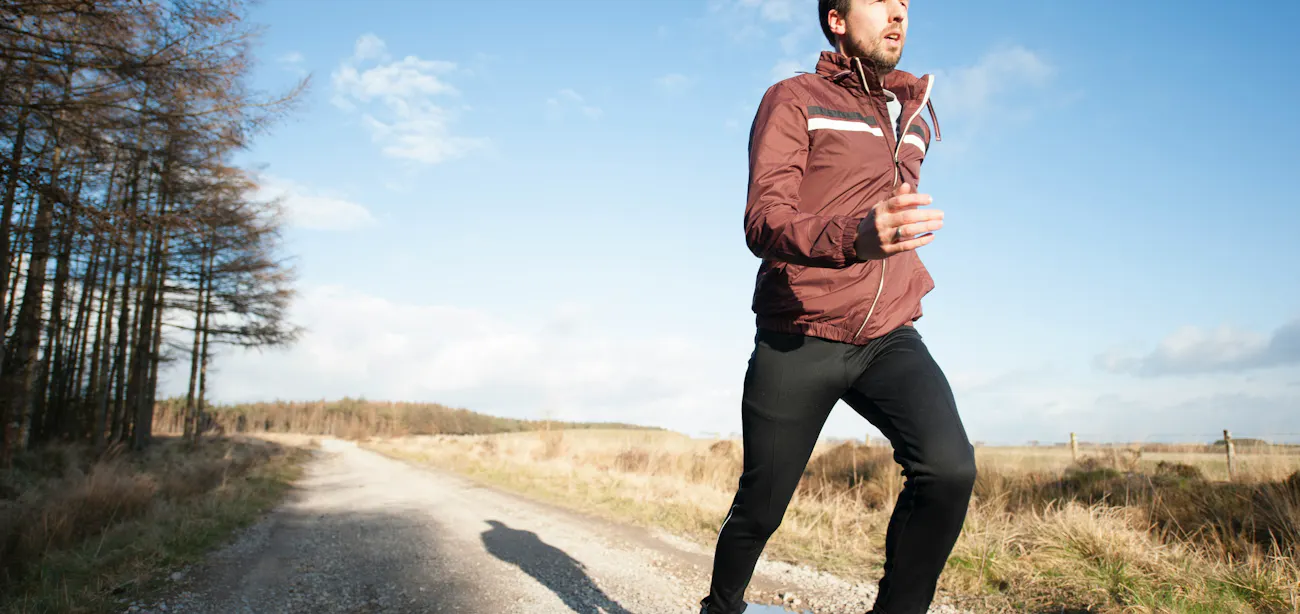 An image showing a young man jogging for a healthy cardiac metabolic health