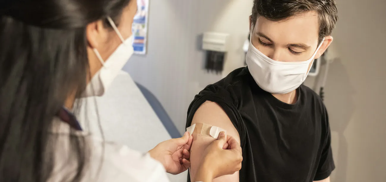 An image showing a person taking a peptide therapy shot for the treatment of long covid