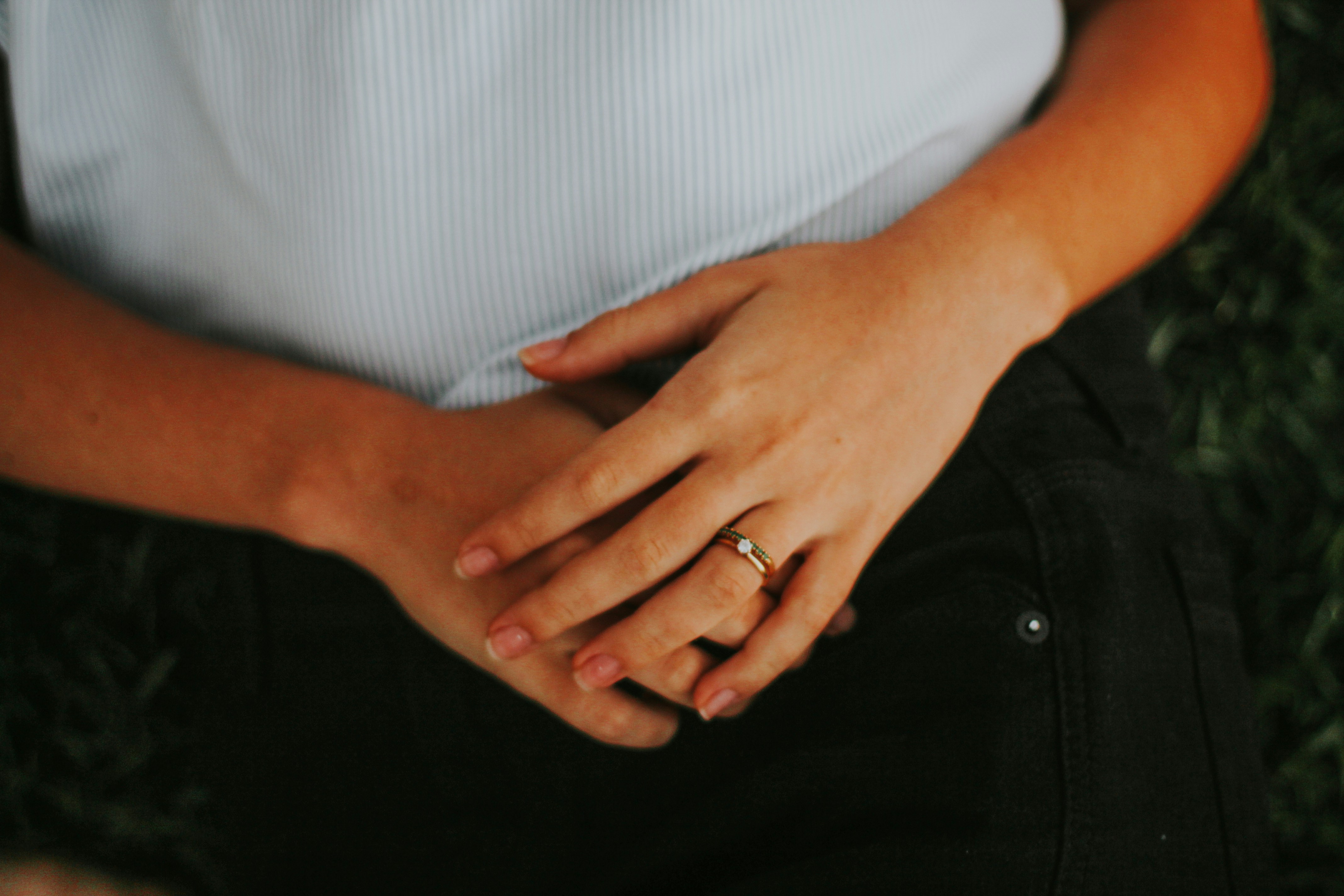 An image showing a person holding her gut