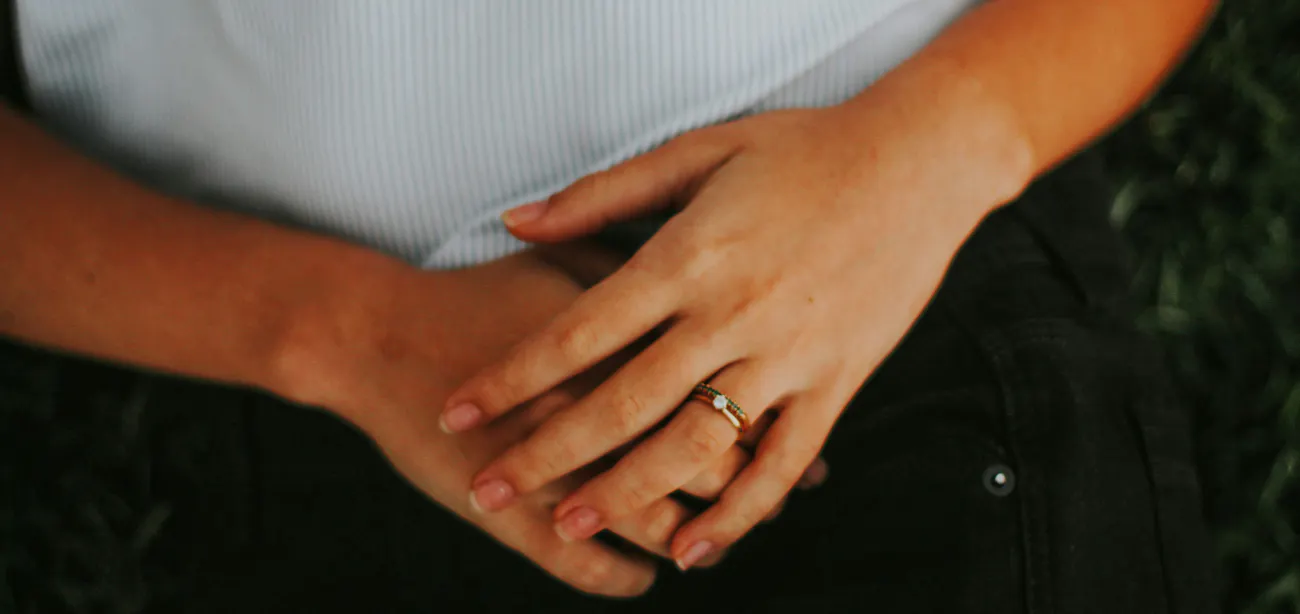 An image showing a person holding her gut