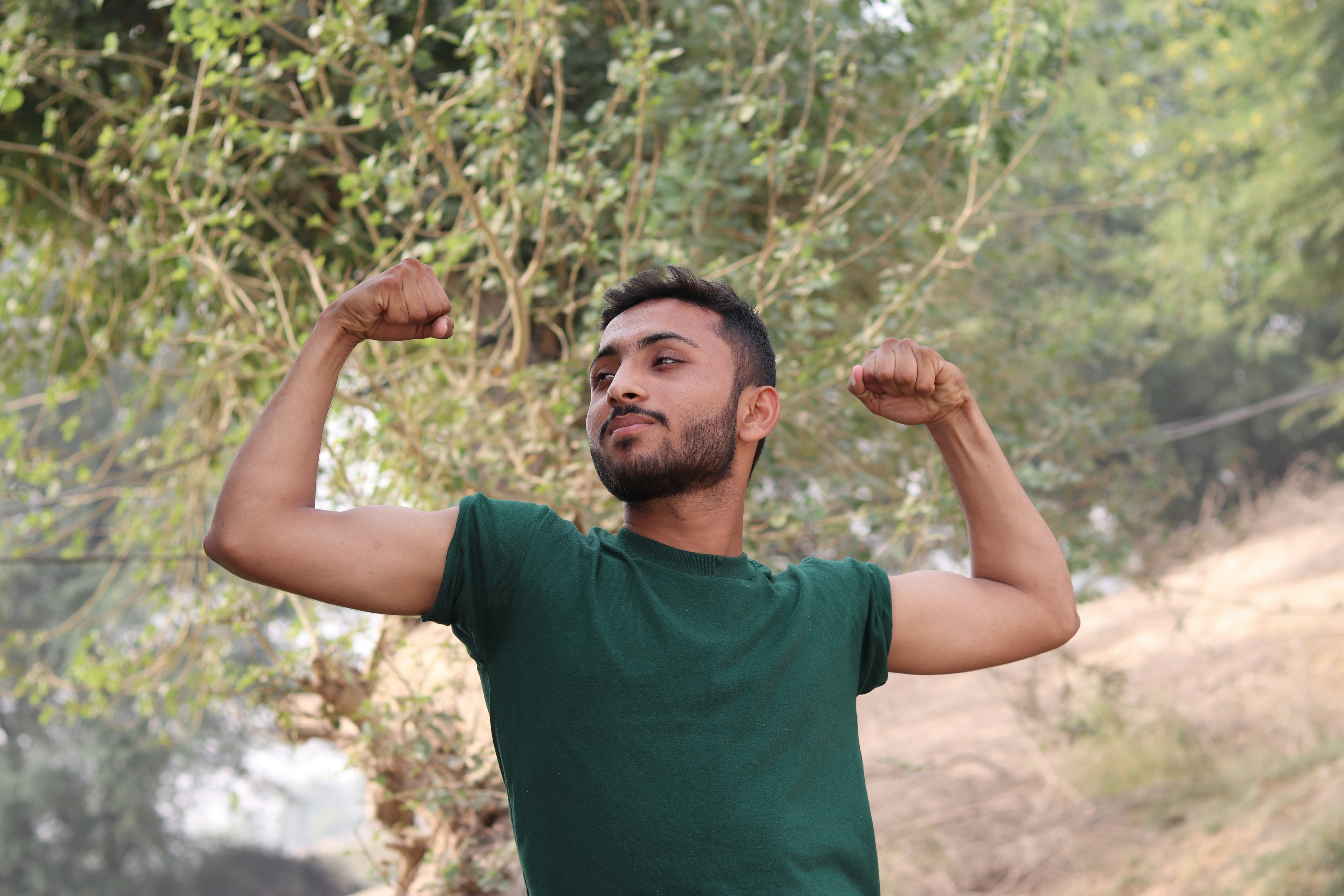 An image of a person flexing his muscle 