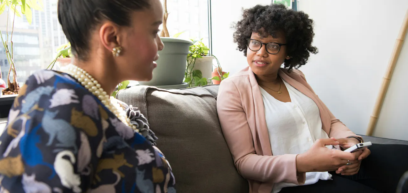 An image showing two women discussing about perimenopause and how peptides is helping