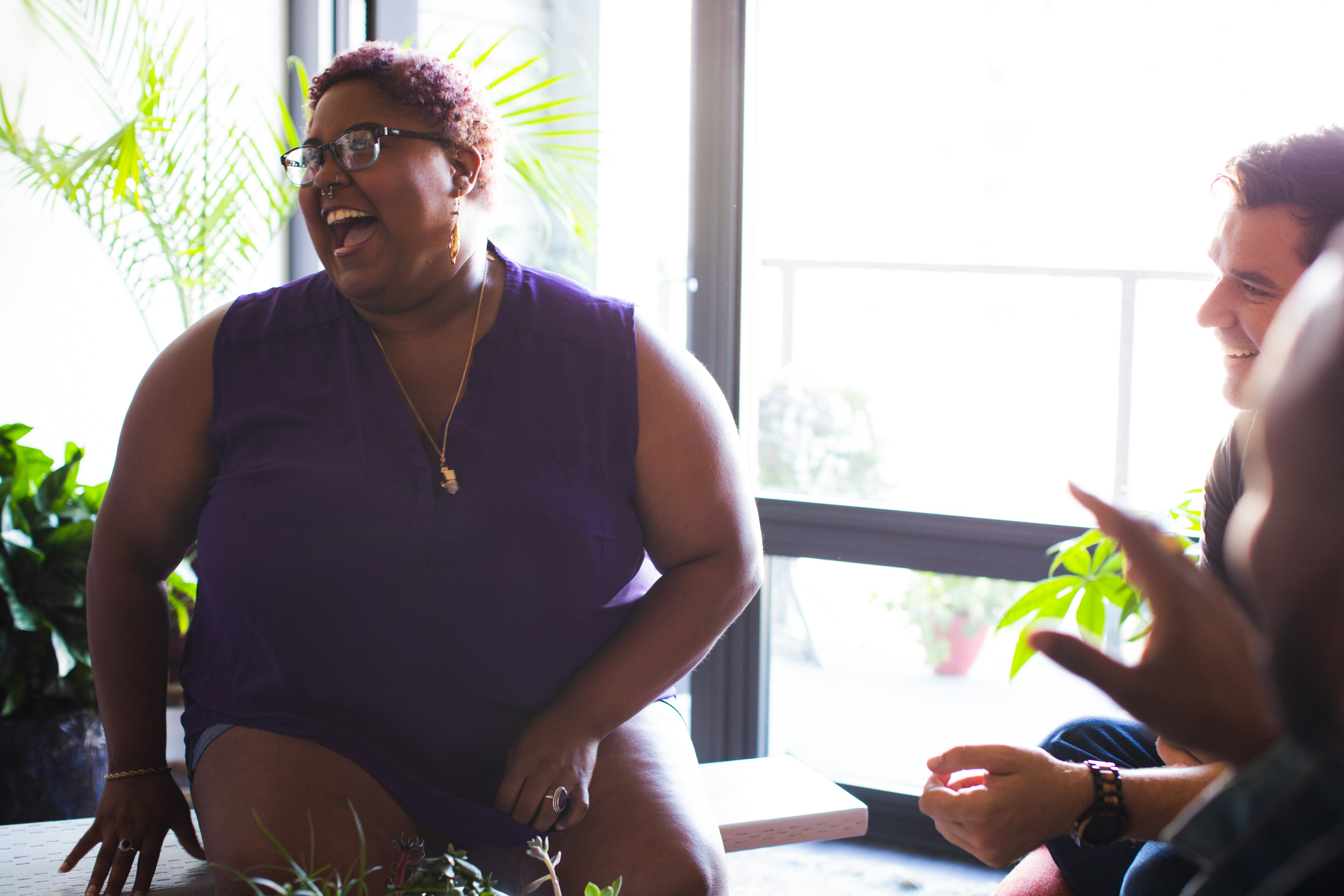 An image showing a woman excited about her new peptide therapy journey