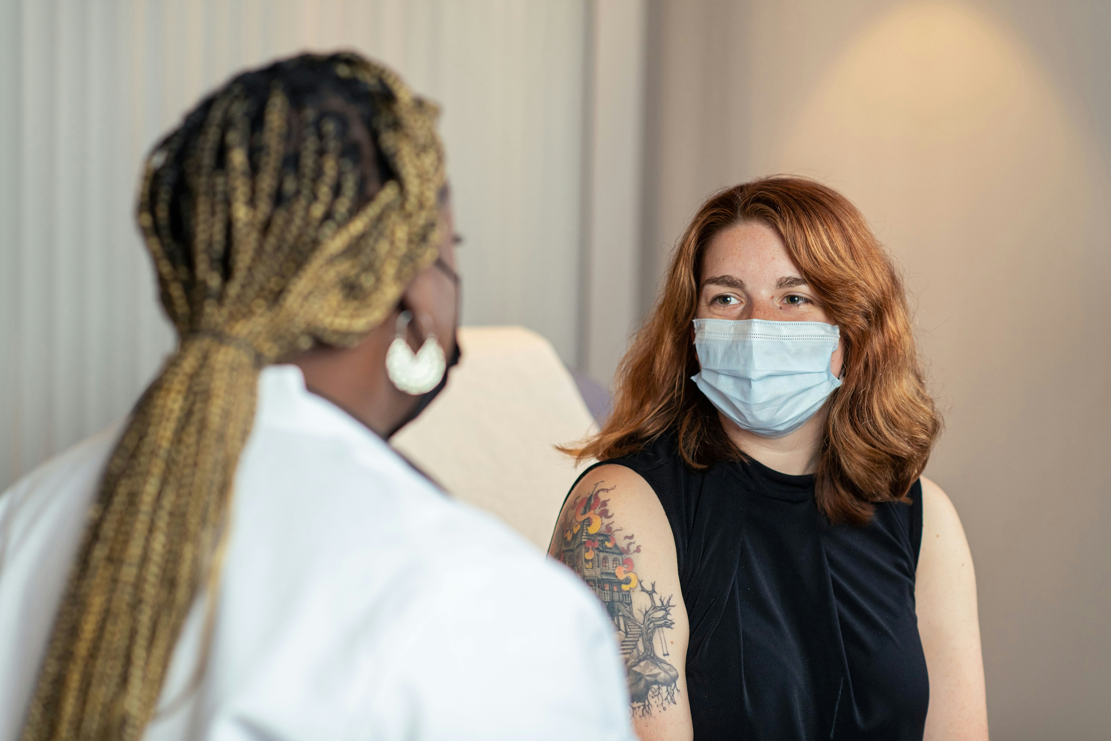 An image showing a patient asking their doctor about their peptide labs