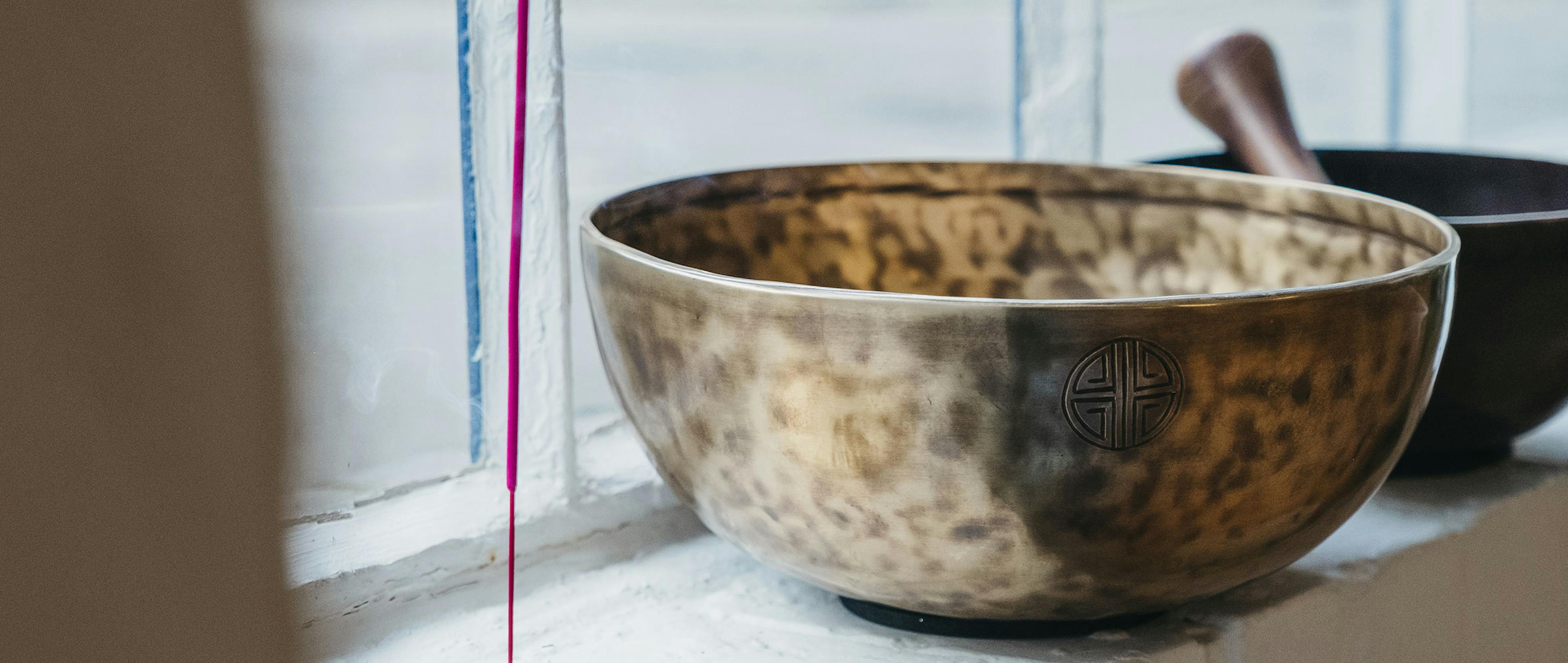 Two sound bowls on a ledge