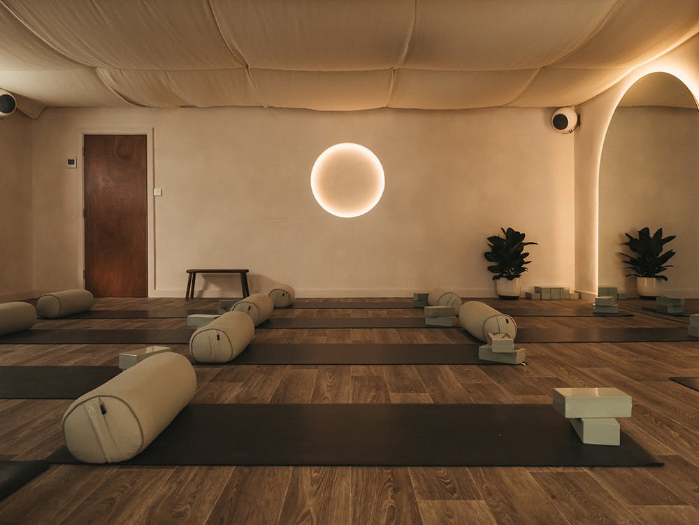 Yoga studio with mats and glowing light