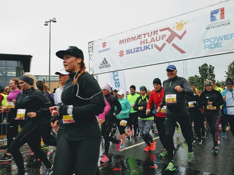 Runners at the Suzuki Midnight Sun Run start on Engjavegur