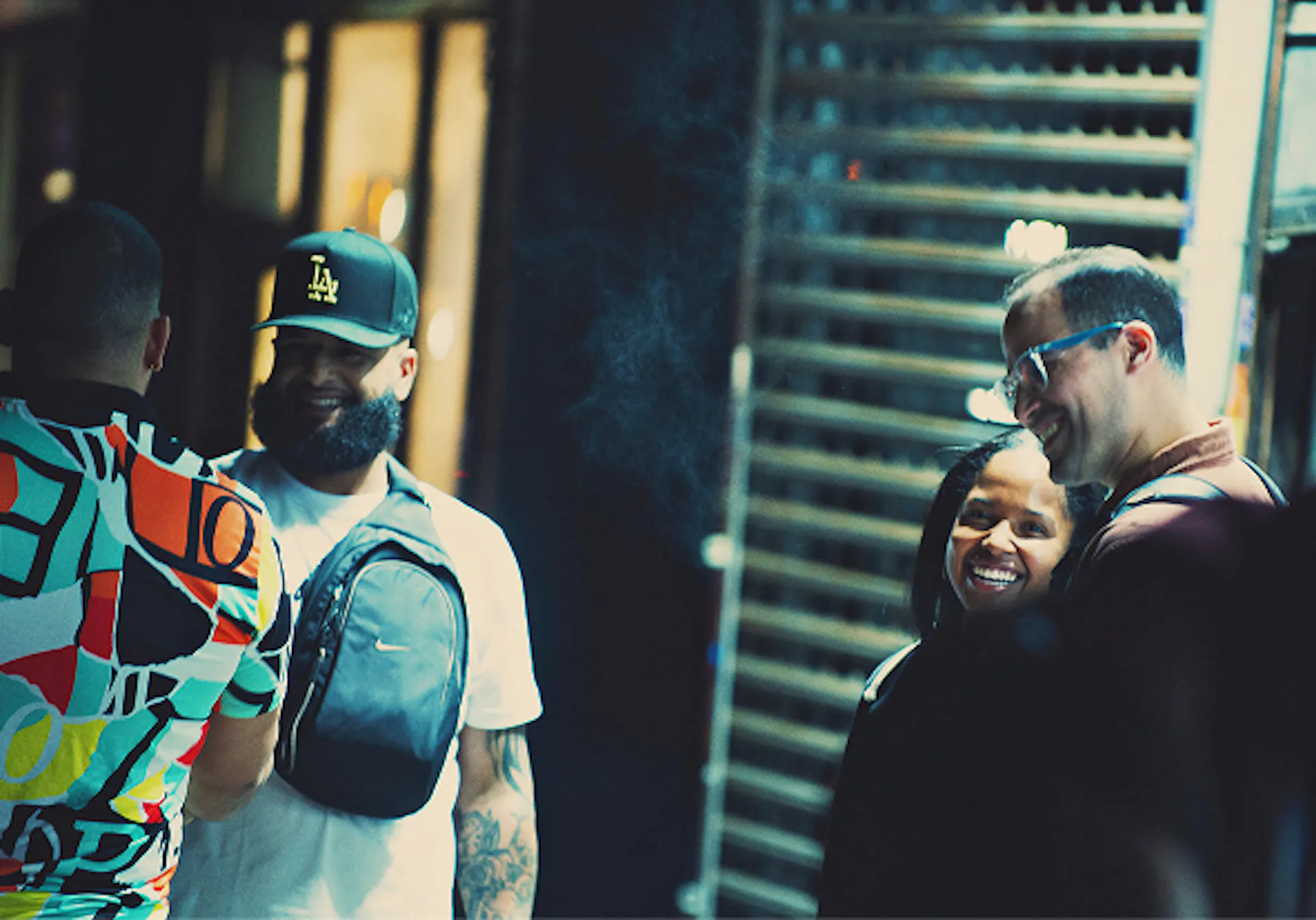 team enjoys laugh outside of store