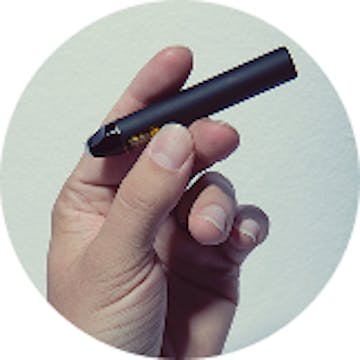 Image of hand holding vape