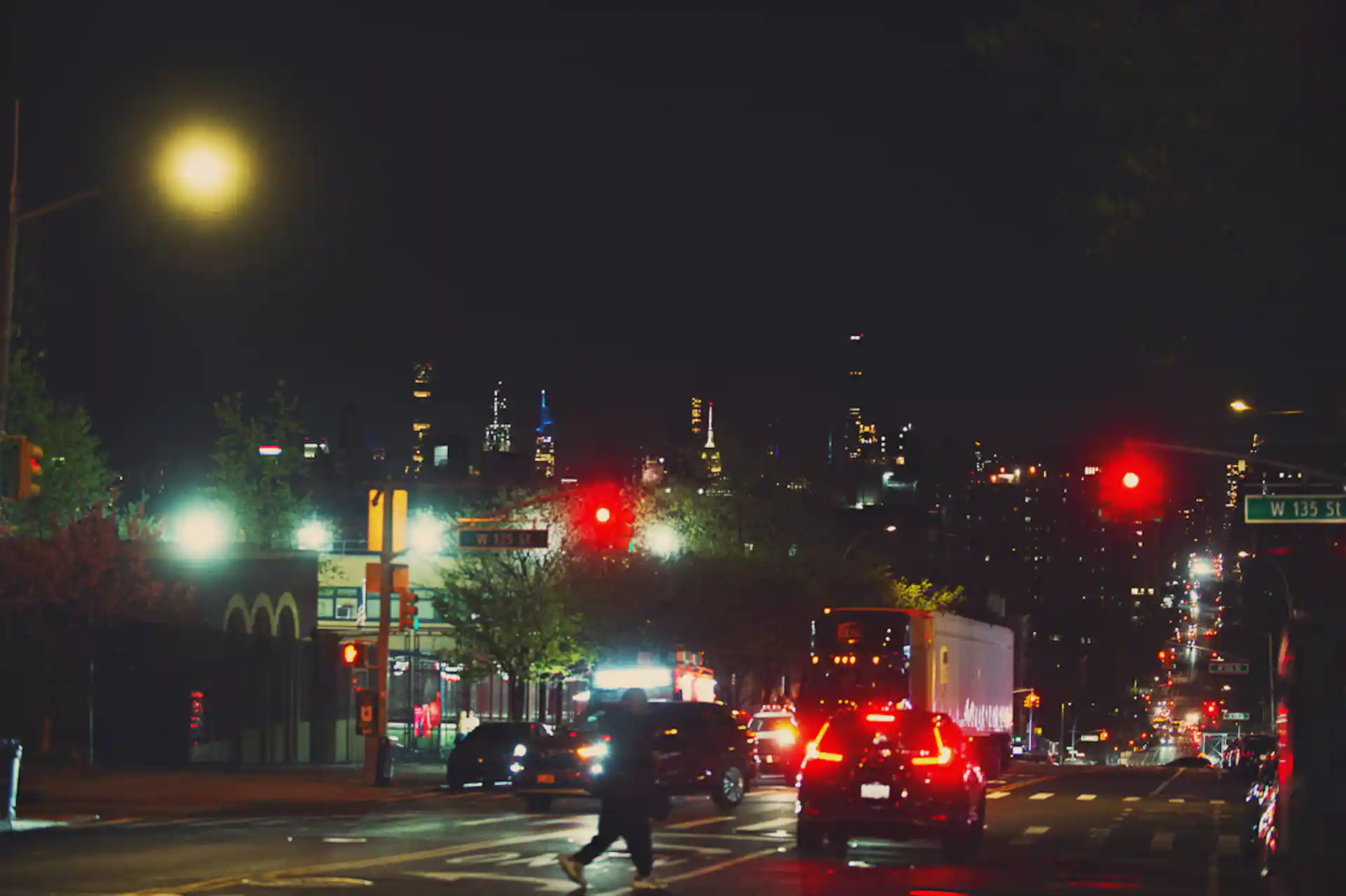 NYC streets facing downtown at nighttime